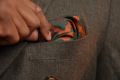 Real Ancient Madder Bronze, Burgundy and Bottle Green pocket square in a rakish puff fold