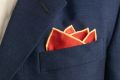 Cardinal Red Silk Wool Pocket Square with Printed geometric medallions in blue, black with buff contrast edge by Fort Belvedere - Crown fold