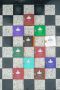 Vertical Roberto Ugolini fragrances on checkerboard