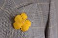 Yellow exotic Flower on Lapel by Fort Belvedere
