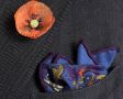 Folded Mid Blue Silk-Wool Pocket Square with Hunting Motifs and Orange Poppy Boutonniere by Fort Belvedere
