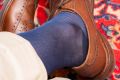 Up-close shot of brown full brogues paired with Over the Calf Silk Socks in Light Navy by Fort Belvedere