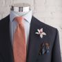 Orchid boutonniere by Fort Belvedere with brown silk pocket square and orange linen tie by Fort Belvedere