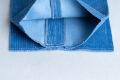 1.5 inches or 3.8 cm of fabric reserve in the leg of a Azure blue colored pair of Stancliffe pants. Also notice the twill back with a nice plush comfortable feel against your skin.