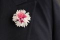 White and Magenta Cornflower Boutonniere Buttonhole Flower Silk in Dark suit