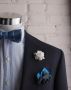White Gardenia boutonniere, green pocket square and blue striped bow tie by Fort Belvedere