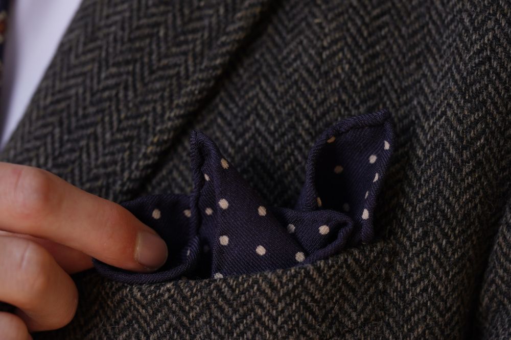 Navy Wool Challis Pocket Square folded in Crown Fold showing handrolled edges by Fort Belvedere