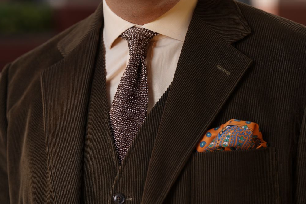 Two-Tone Knit Tie in Brown and Beige Changeant Silk and   
Silk Pocket Square in Sunflower Orange with Small and Large Paisley