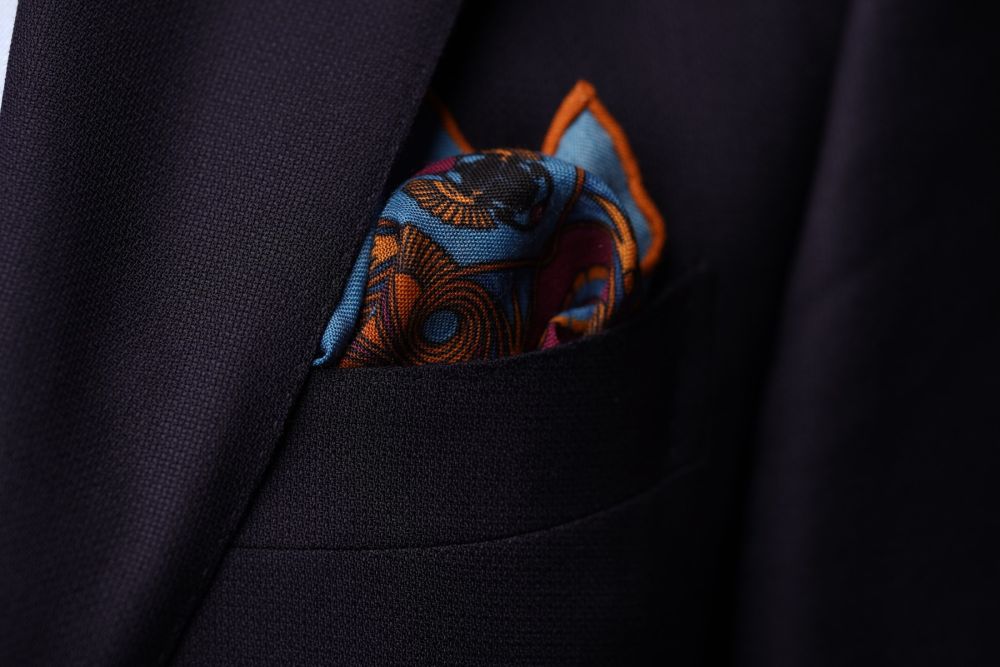 Copper Red Pocket Square Art Deco Egyptian Scarab pattern in royal blue, teal, yellow, with blue contrast edge by Fort Belvedere - Crown and Puff mix fold