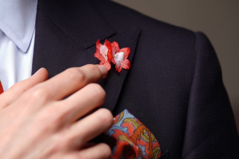 Pink Wildlfower Boutonniere Buttonhole in navy suit
