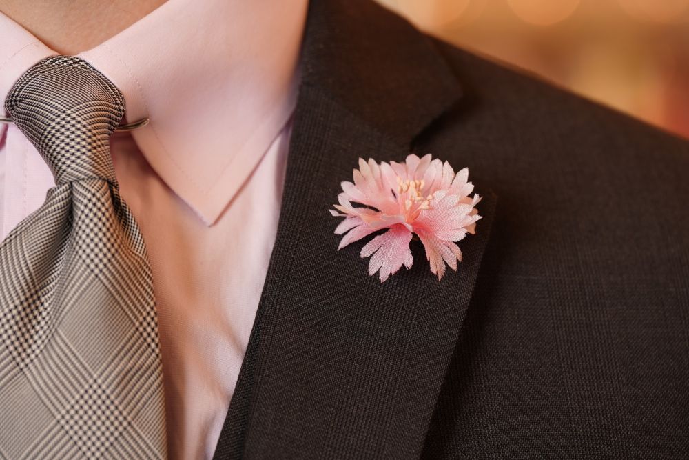 Pink Cornflower Boutonniere Buttonhole Flower Silk Fort Belvedere and Prince of Wales Check Silk Tie Dark Navy and White in dark suit
