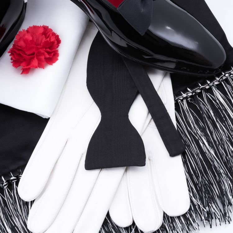 Black Bow Tie in Silk Faille Grosgrain with Red Carnation Boutonniere and Evening Scarf in Black & White Silk Satin and Black Dress Shoes with White Unlined Leather Gloves