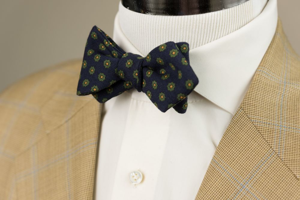 In action Wool Challis Bow Tie in Navy Blue with Green & Yellow Pattern  - Fort Belvedere