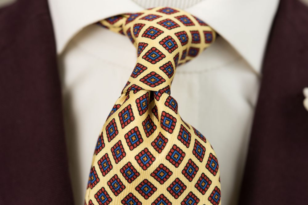 In Action Madder Print Silk Tie in Yellow with Red, Blue and Orange Diamond Pattern - Handmade by Fort Belvedere