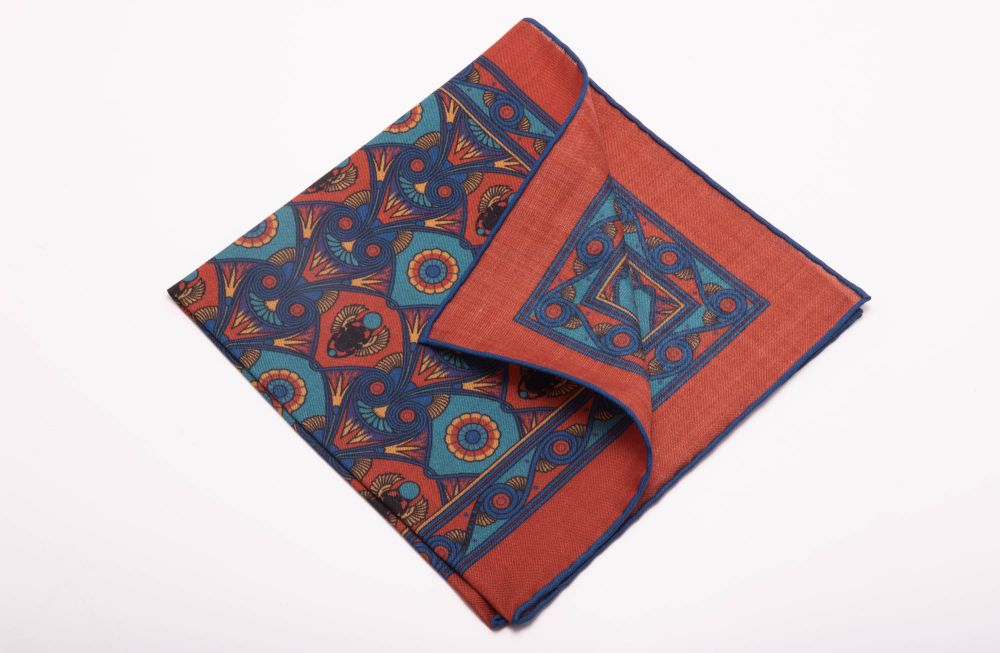 Back of Copper Red Pocket Square Art Deco Egyptian Scarab pattern in royal blue, teal, yellow, with blue contrast edge by Fort Belvedere