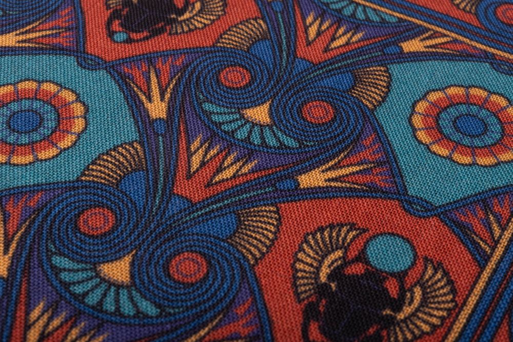 Fabric details of Copper Red Pocket Square Art Deco Egyptian Scarab pattern in royal blue, teal, yellow, with blue contrast edge by Fort Belvedere
