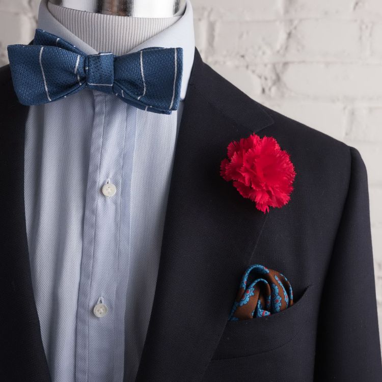 Dark Red Carnation with brown, blue, red real ancient madder silk pocket sqaure and blue jacquard striped bow tie