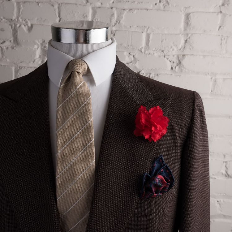 Dark Red Carnation with brown suit, blue and orange pocket square with beige jacquard striped silk tie - Fort Belvedere