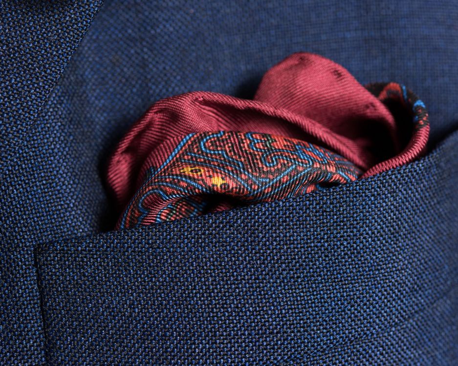 Close up Folded Burgundy Silk Pocket Square with little Paisley