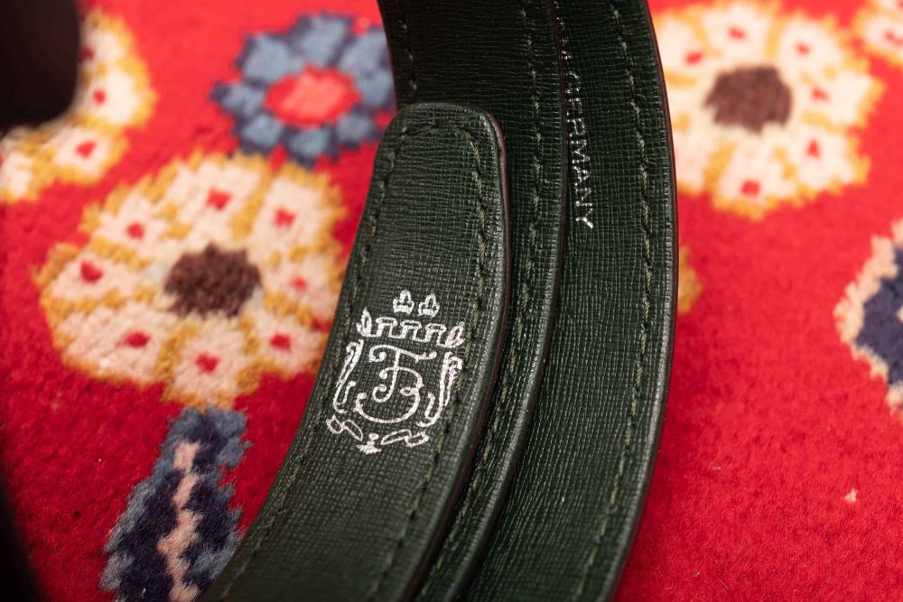 Embossed silver Fort Belvedere logo on green Saffiano leather lining
