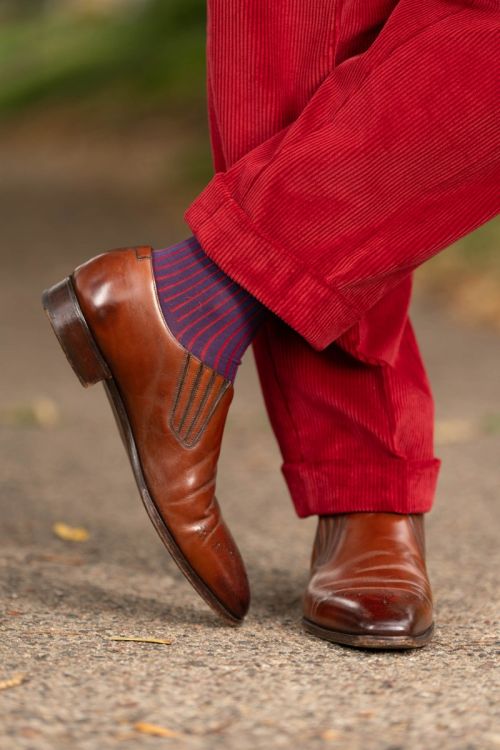 Garnet Red corduroy trousers paired with Shadow Stripe Ribbed Socks Navy Blue and Red.