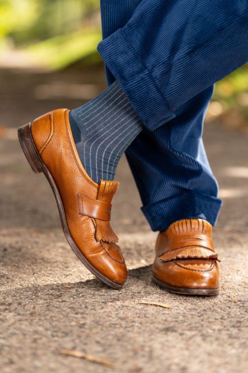 Infantry Blue Corduroy trousers with cuffs paired with brown tassel loafer and shadow stripe Socks.