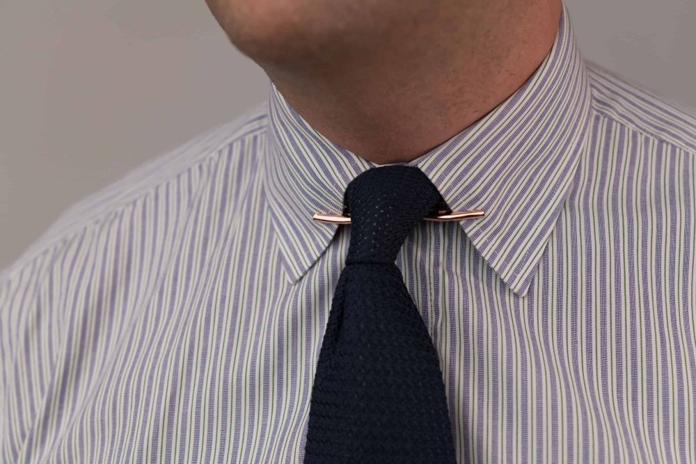 Large Brass Collar Clip in Rose Gold with Greandine silk tie in navy both by Fort Belvedere