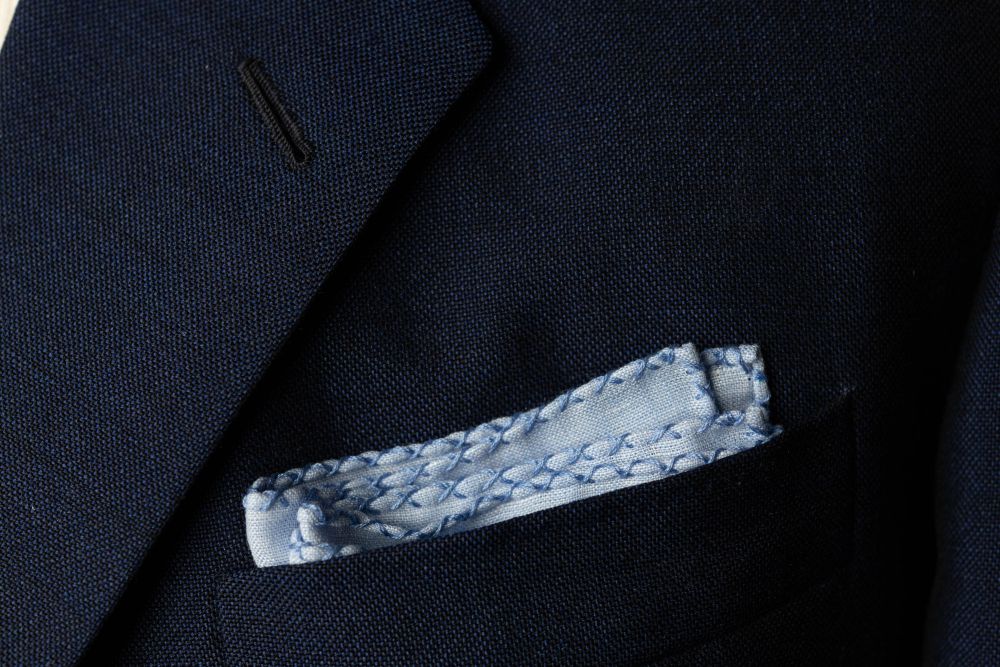 Light Blue Linen Pocket Square with Blue Handrolled Cross X Stitch - Fort Belvedere - Square Fold