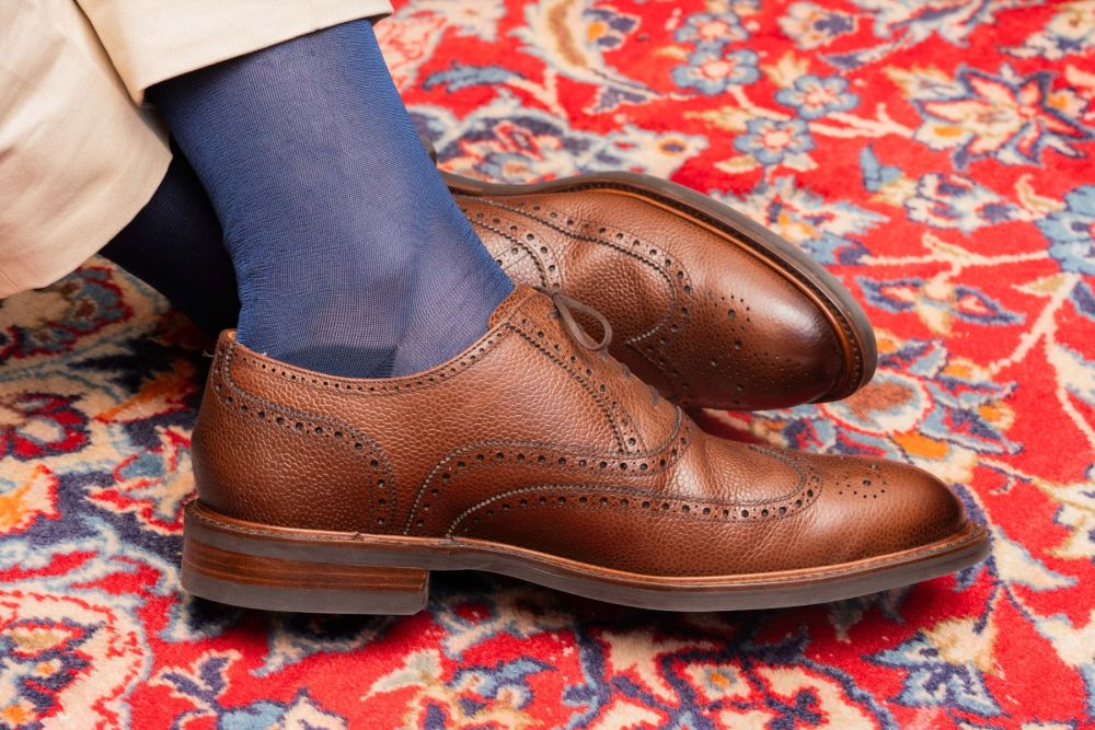 Full shot of brown full brogues paired with Over the Calf Silk Socks in Light Navy by Fort Belvedere
