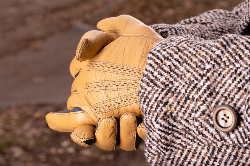 Light Tan Lamb Nappa Touchscreen Gloves with Denim Blue Contrast Focused Image when Worn