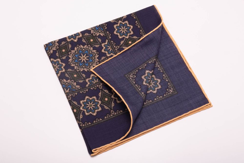 Back of Navy Blue Silk Wool Pocket Square with Printed geometric medallions in green, blue and orange with off-white contrast edge - Fort Belvedere