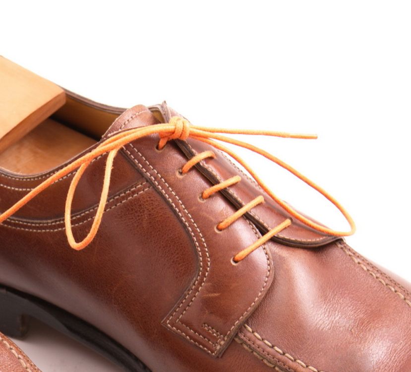 Orange shoelaces made of waxed cotton by Fort Belvedere