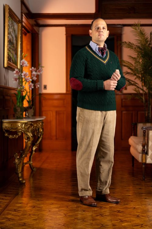 Raphael in a knit sweater paired with the pale taupe corduroy pants.