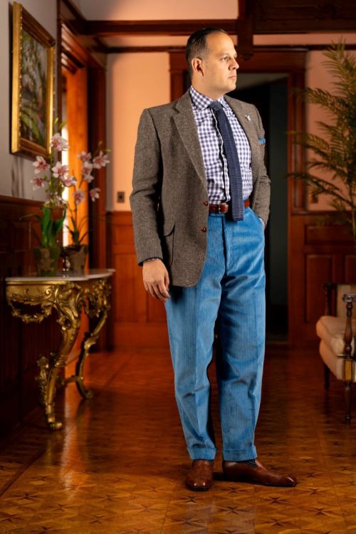 Raphael wearing Stancliffe Corduroy Flat Front Trouser in Azure Blue
