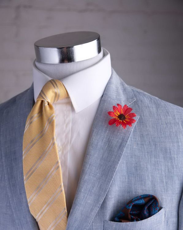 Red Exotic Boutonniere with brown center, linen sport coat in light blue, yellow striped tie and madder pocket square