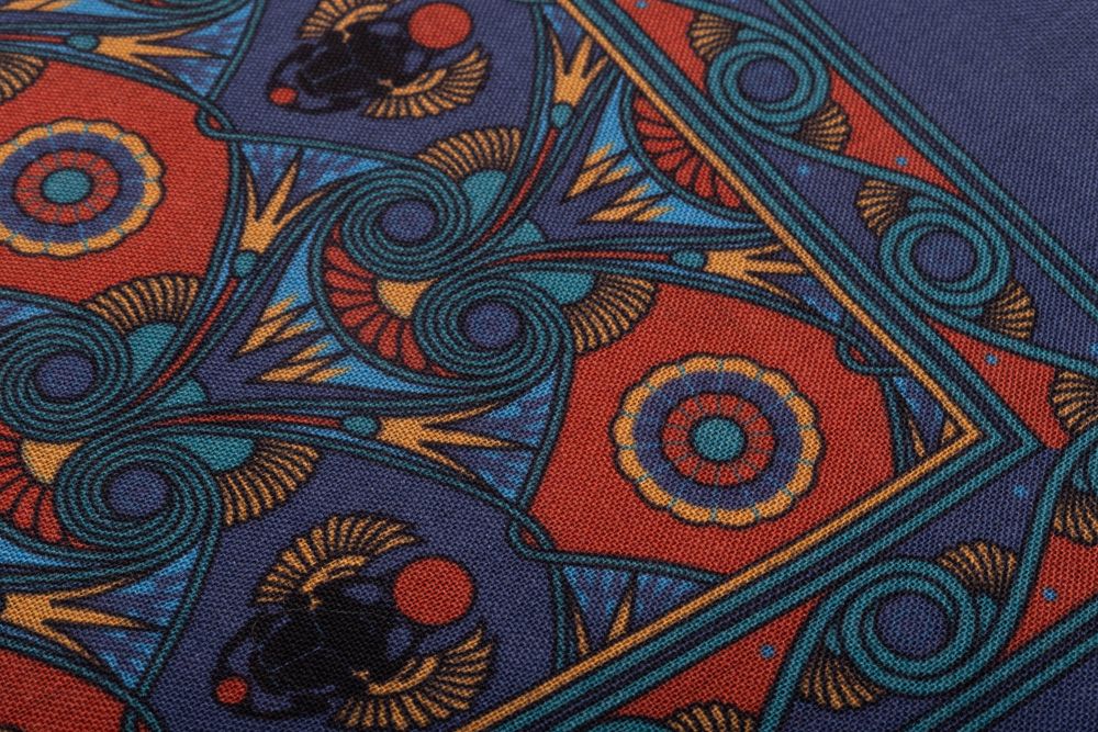 Fabric details of Sapphire Blue Pocket Square Art Deco Egyptian Scarab pattern in burnt orange, yellow, madder blue with teal contrast edge by Fort Belvedere 