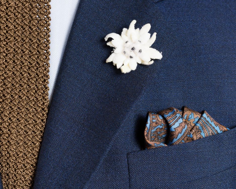 Silk Pocket Square in Brown with Blue Paisley and Edelweiss Boutonniere with Knit Tie in Solid Brown Tobacco Silk