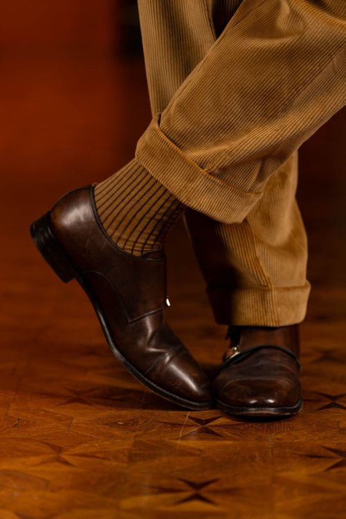 Camel Corduroy trousers with cuffs paired with brown monk straps and Caramel and Dark Burgundy Shadow Stripe Ribbed Socks.