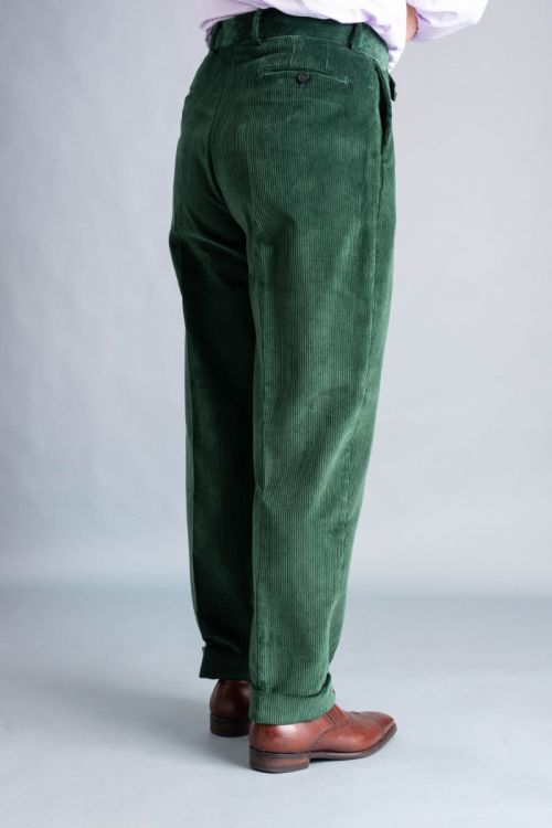 Backview from the side of British Racing Green High-waisted, full-cut 8-Wale corduroy flat-front trousers with a British Style Fabric, Made in Italy by Fort Belvedere.