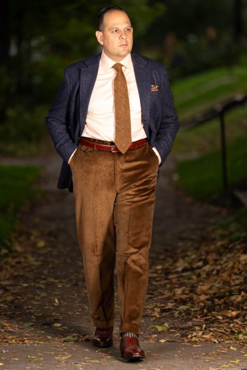 Raphael wearing Stancliffe Corduroy Flat Front Trouser in Cognac