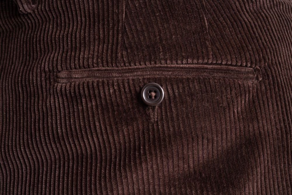 Back pocket detail of the Dark Brown corduroy trousers