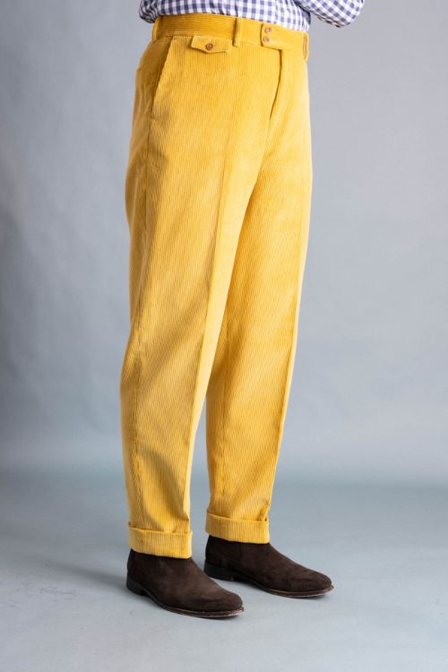 Right side angle front view of the Golden Yellow corduroy trousers.