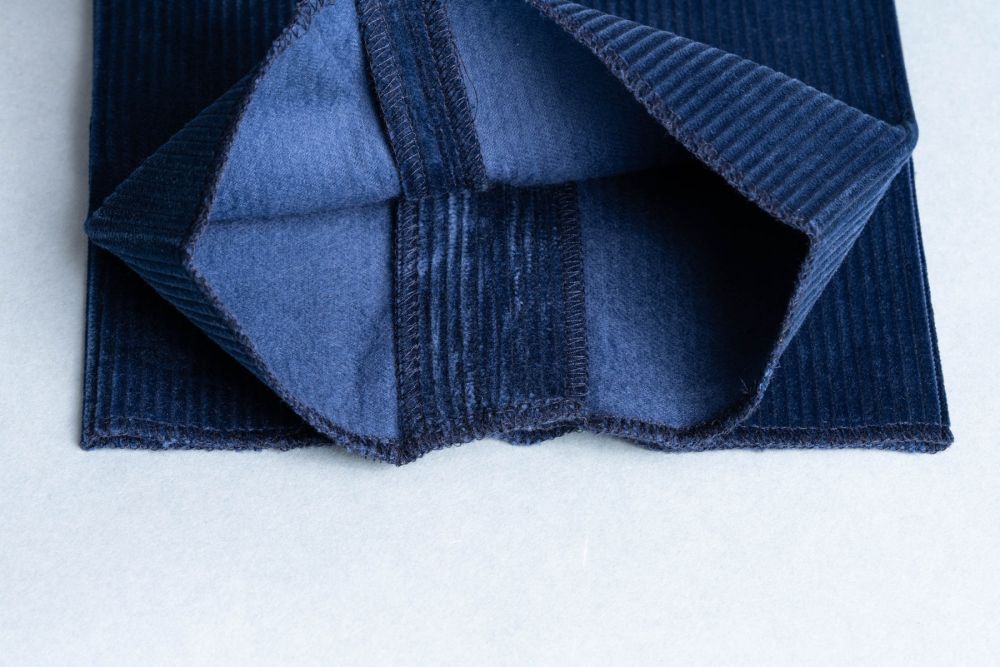 1.5 inches or 3.8 cm of fabric reserve in the leg. of infantry blue colored Stancliffe pants by Fort Belvedere. Also notice the twill back with a nice plush comfortable feel against your skin.