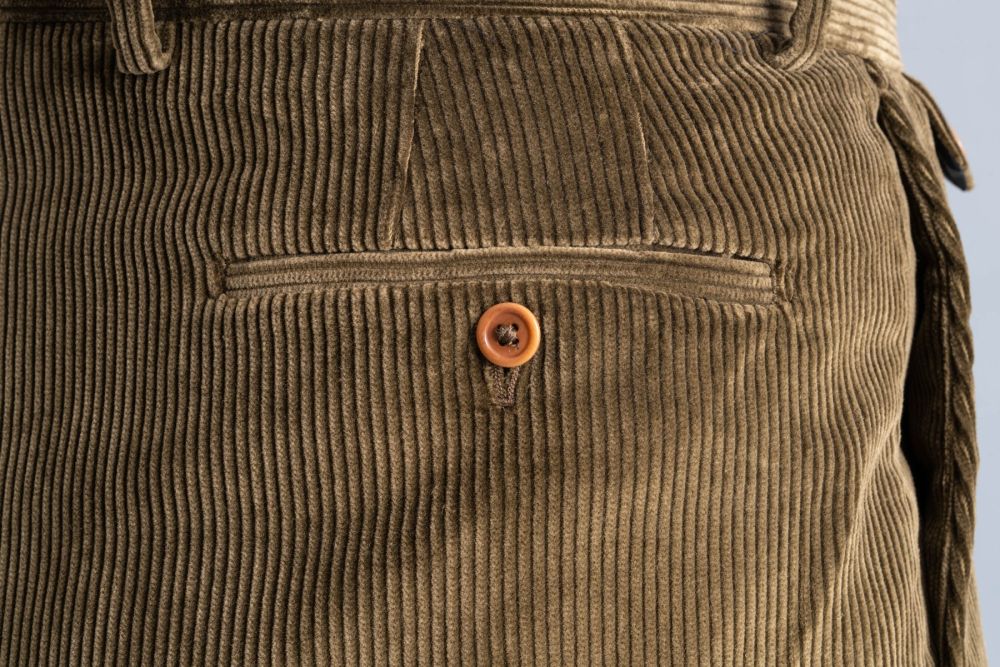 Close up view of the back pocket of the Khaki Drab Corduroy trousers. 