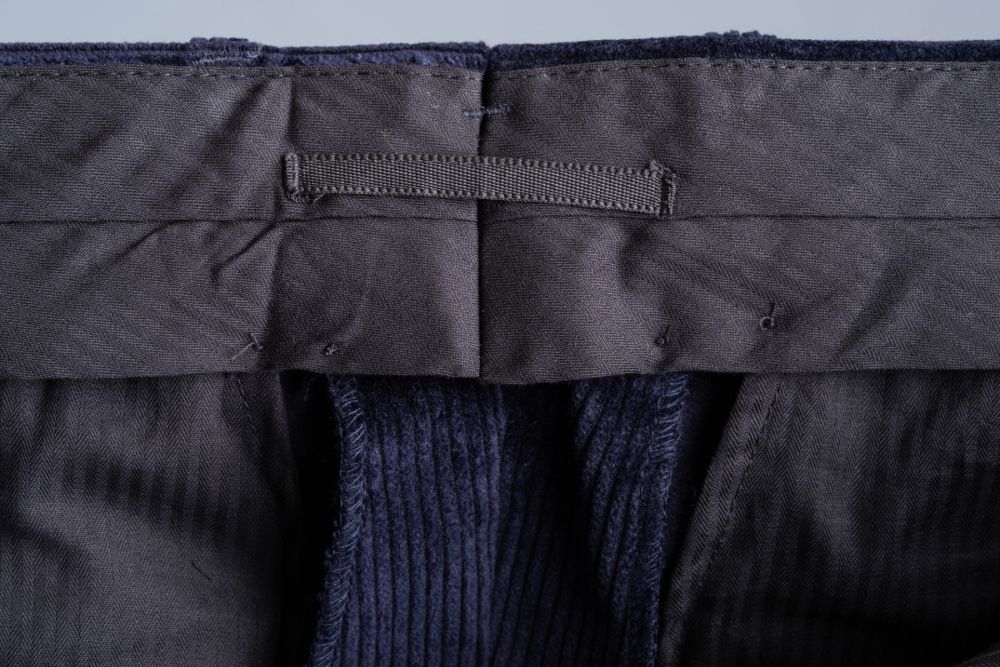 Midnight Blue Stancliffe Corduroy Pants with 3 inches or 7.5 cm fabric reserve in the waist and a practical look on the inside to hang the pants.