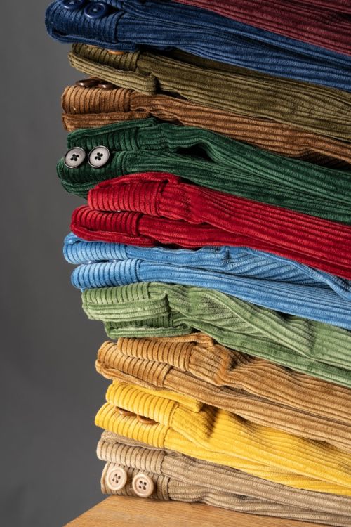 Casually stacked Fort Belvedere Corduroy pants in multiple colors