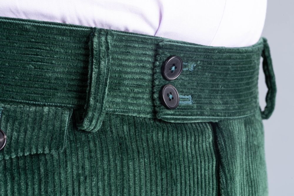 Extended waistband with room for belts up to 43mm in width or 1.75 inches. Also you can see the dark genuine horn buttons on the closure