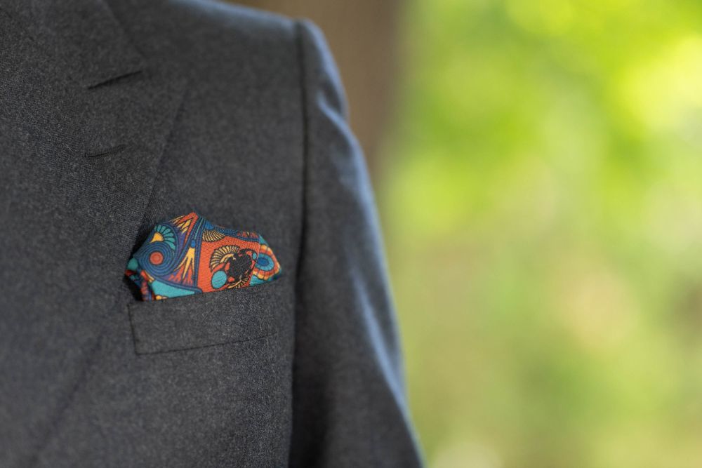Copper Red Pocket Square Art Deco Egyptian Scarab pattern in royal blue, teal, yellow, with blue contrast edge by Fort Belvedere