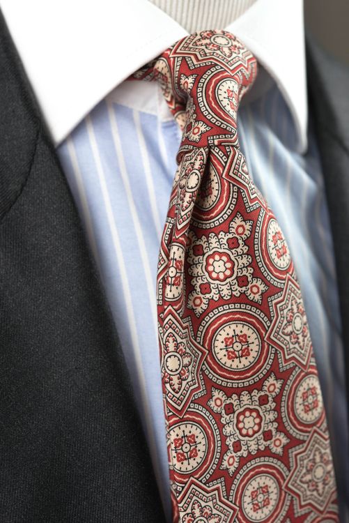 In Action Ancient Madder Silk Tie in Red with Large Buff & Black Pattern Fort Belvedere