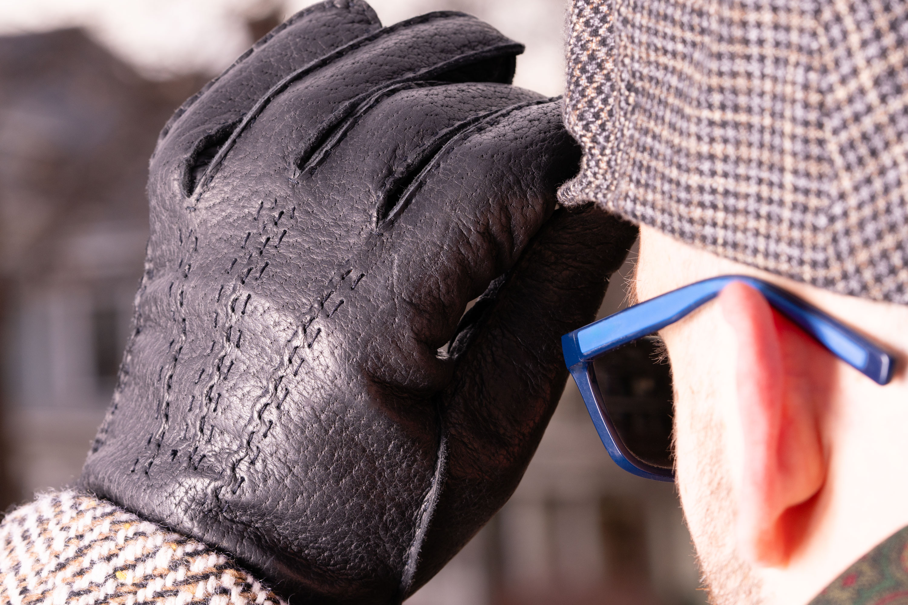 Raphael wearing Peccary Gloves in Charcoal Black with Rabbit Fur Lining 